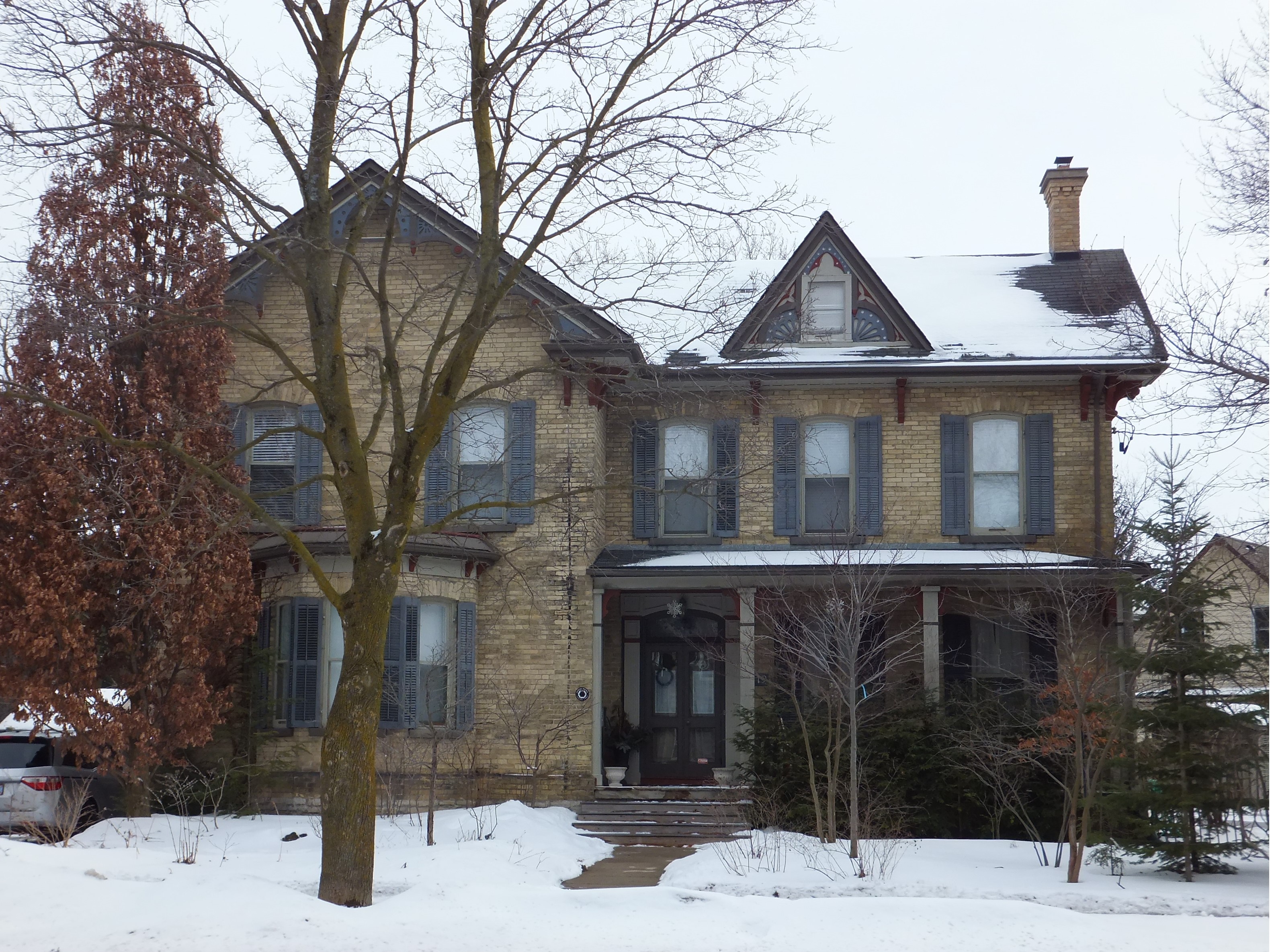 Yellow brick Italianate with Gothic Revival elements style house