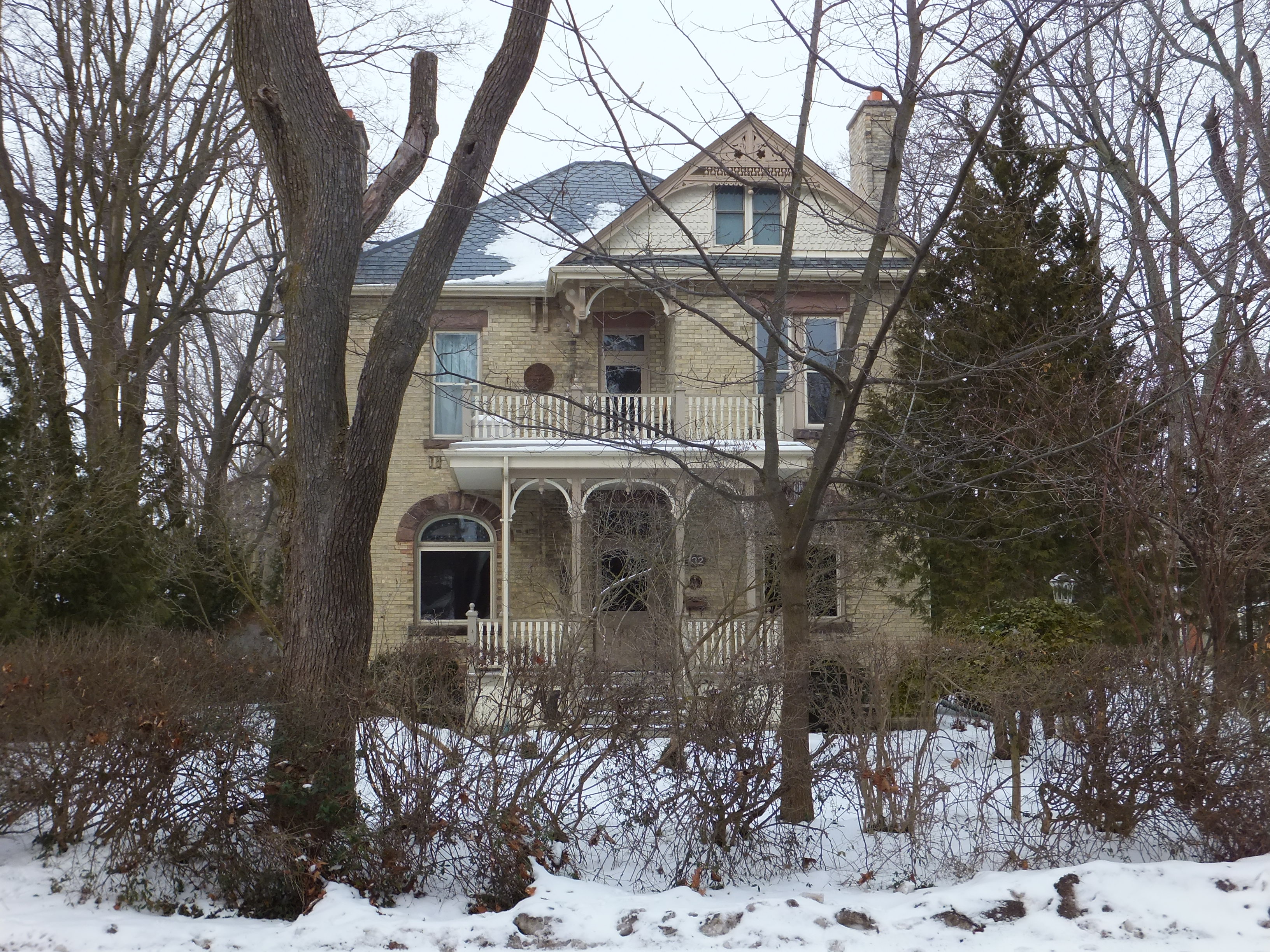 Yellow brick Queen Anne style house