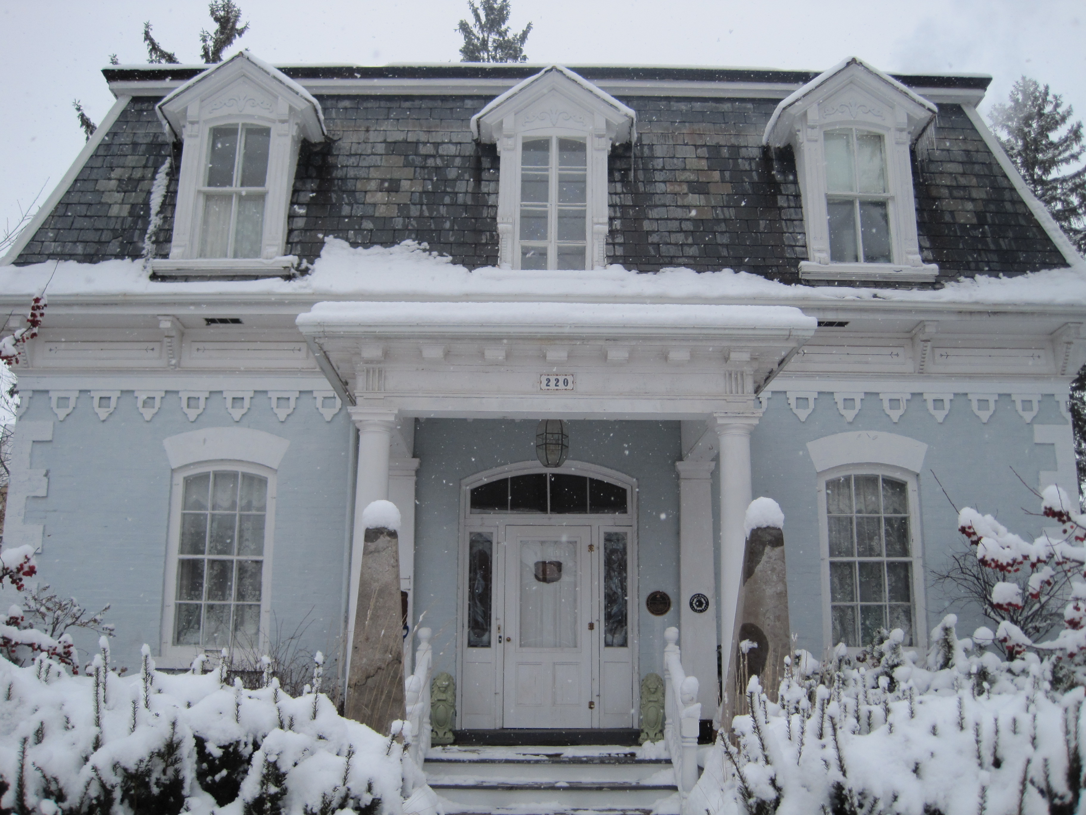 Light grey painted brick, Second Empire style house