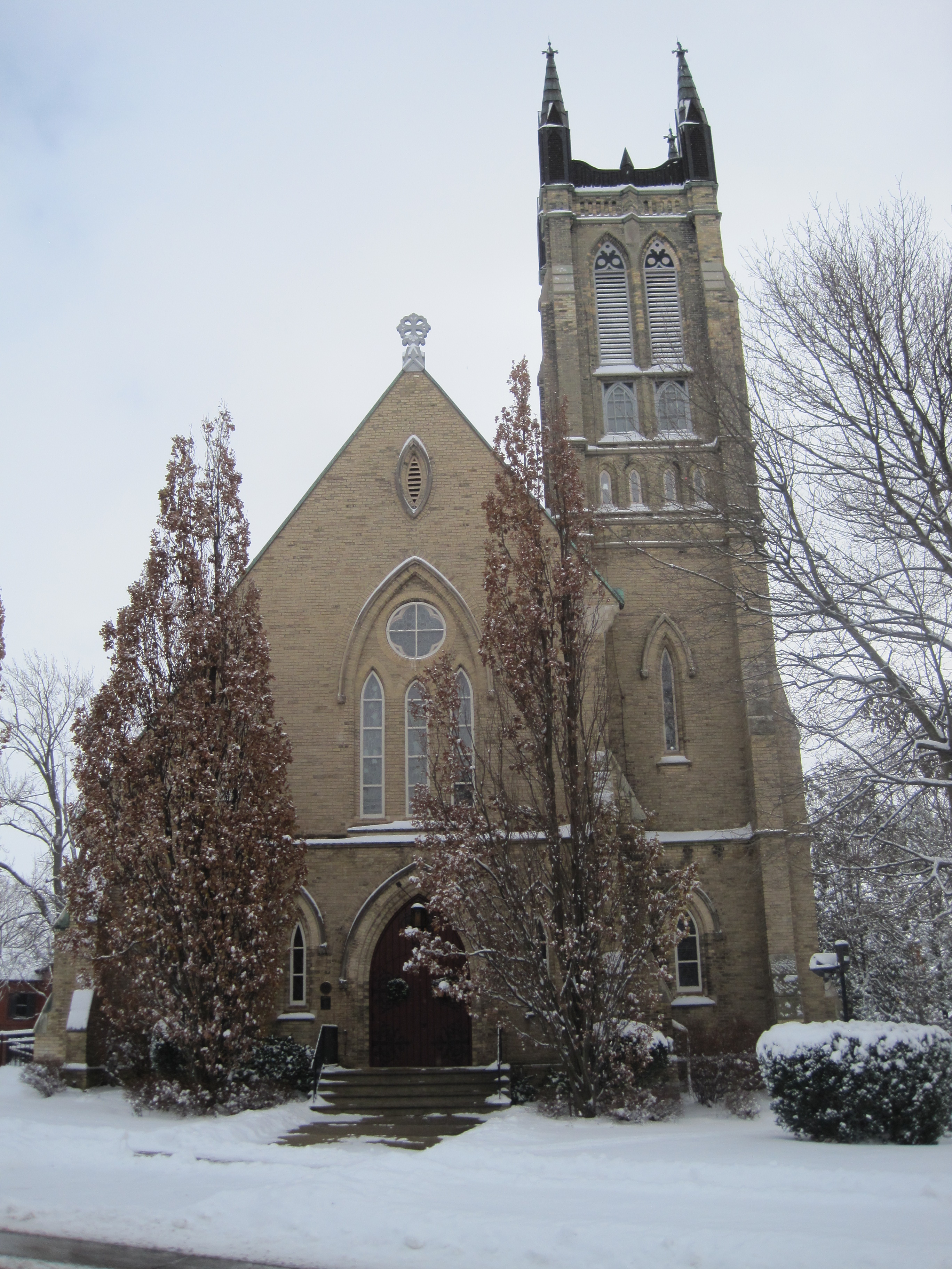 Yellow brick Gothic Revival style church
