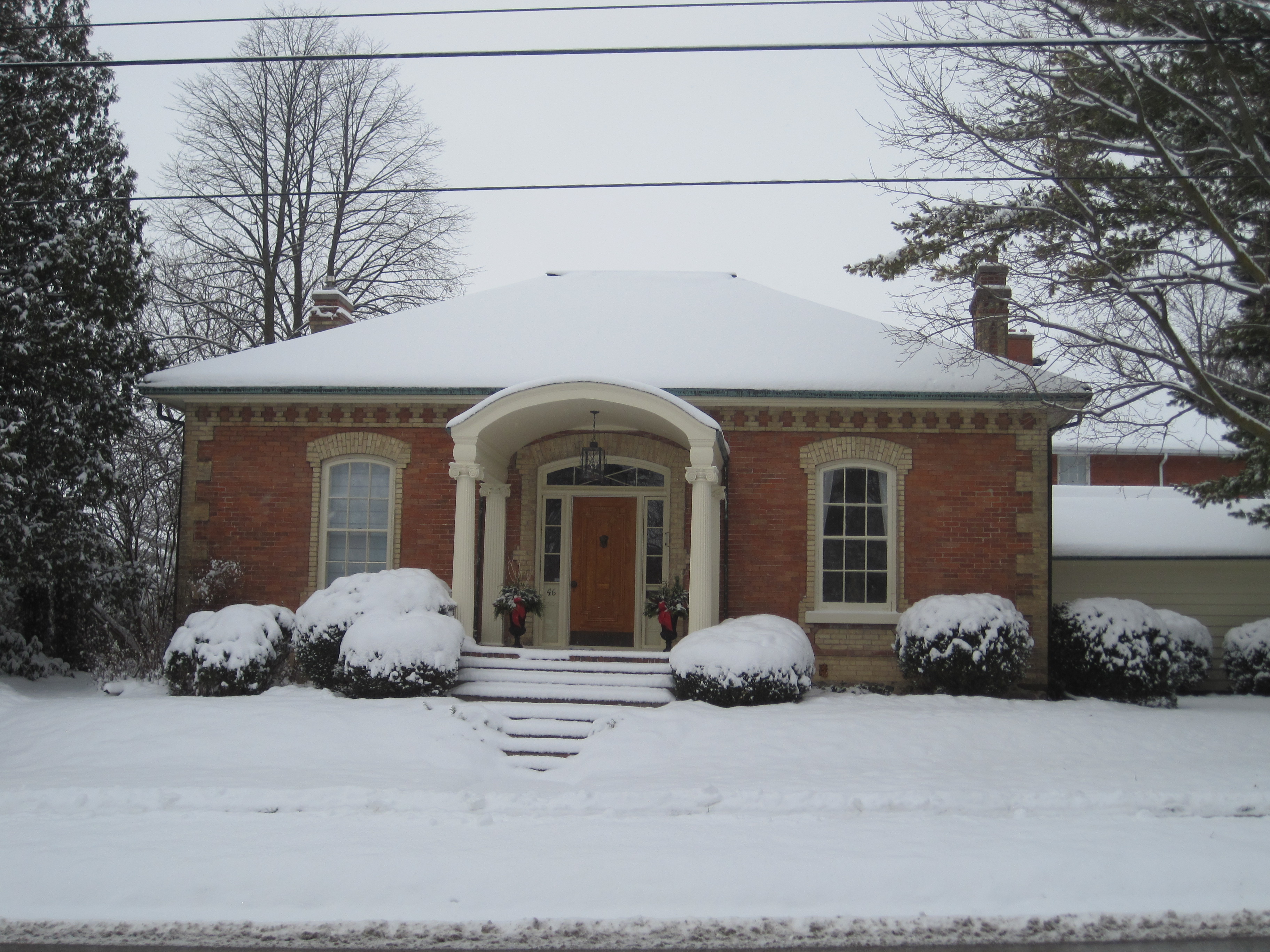 Light red brick with yellow brick accents, Ontario Cottage style house