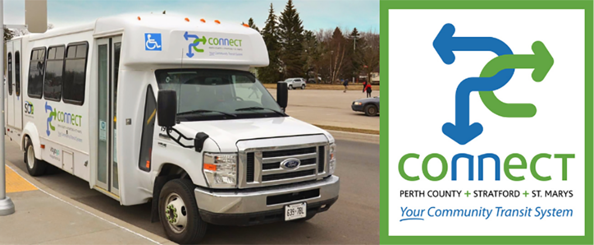 A white PC Connect bus parked at a transit terminal