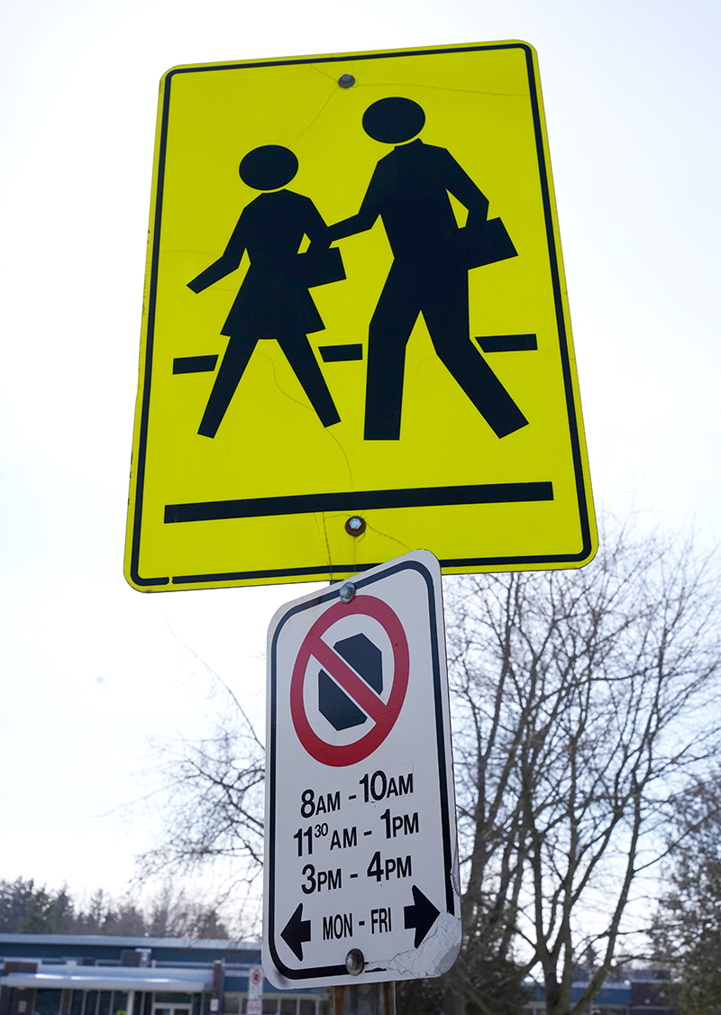 No Stopping sign under School Zone sign