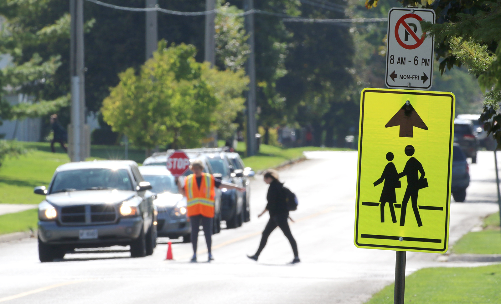 Photo of school crossing guard with student