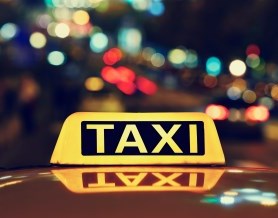 Taxi sign on top of car