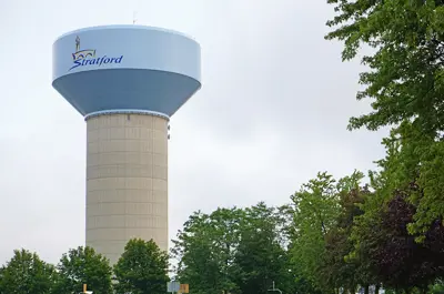 water tower with trees in the foreground