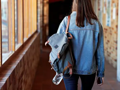 youth with backpack on