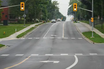 street intersection with traffic lights and turning lane