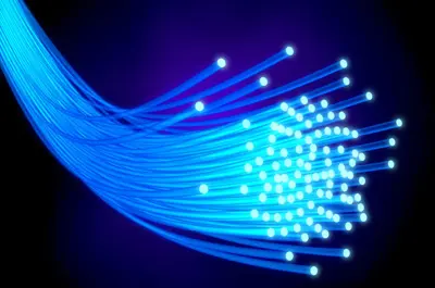Glowing ends of fibre optic cable against a dark background
