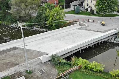 A new bridge being constructed in a residential neighbourhood